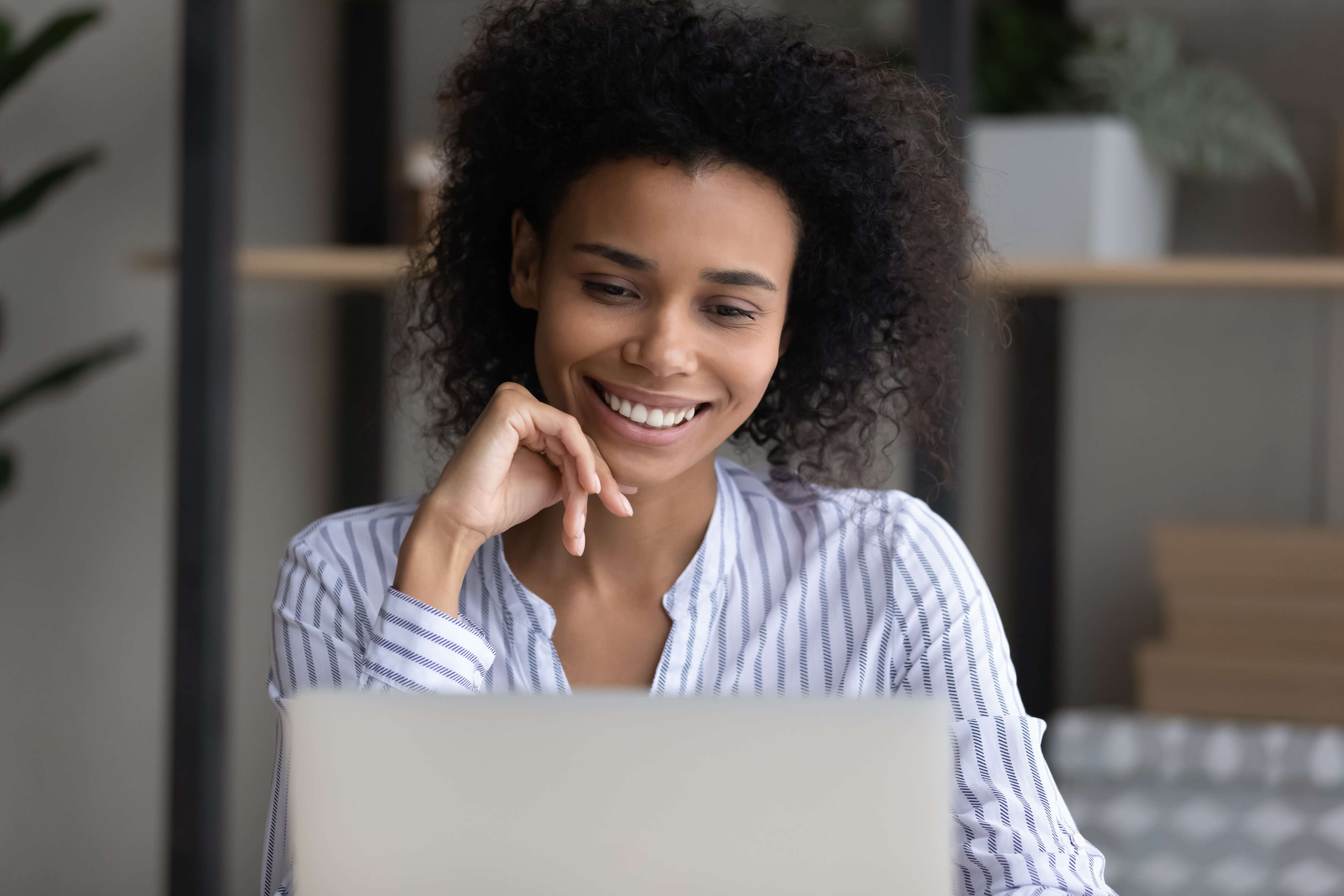 Image of young woman at laptop